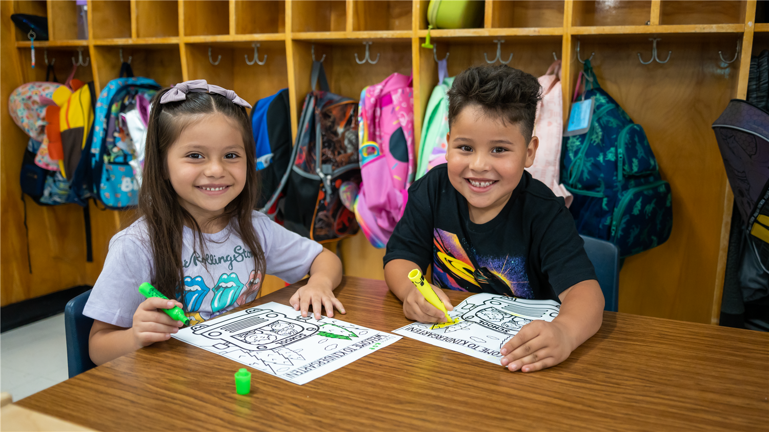 Students smiling in class. Students smiling in class.